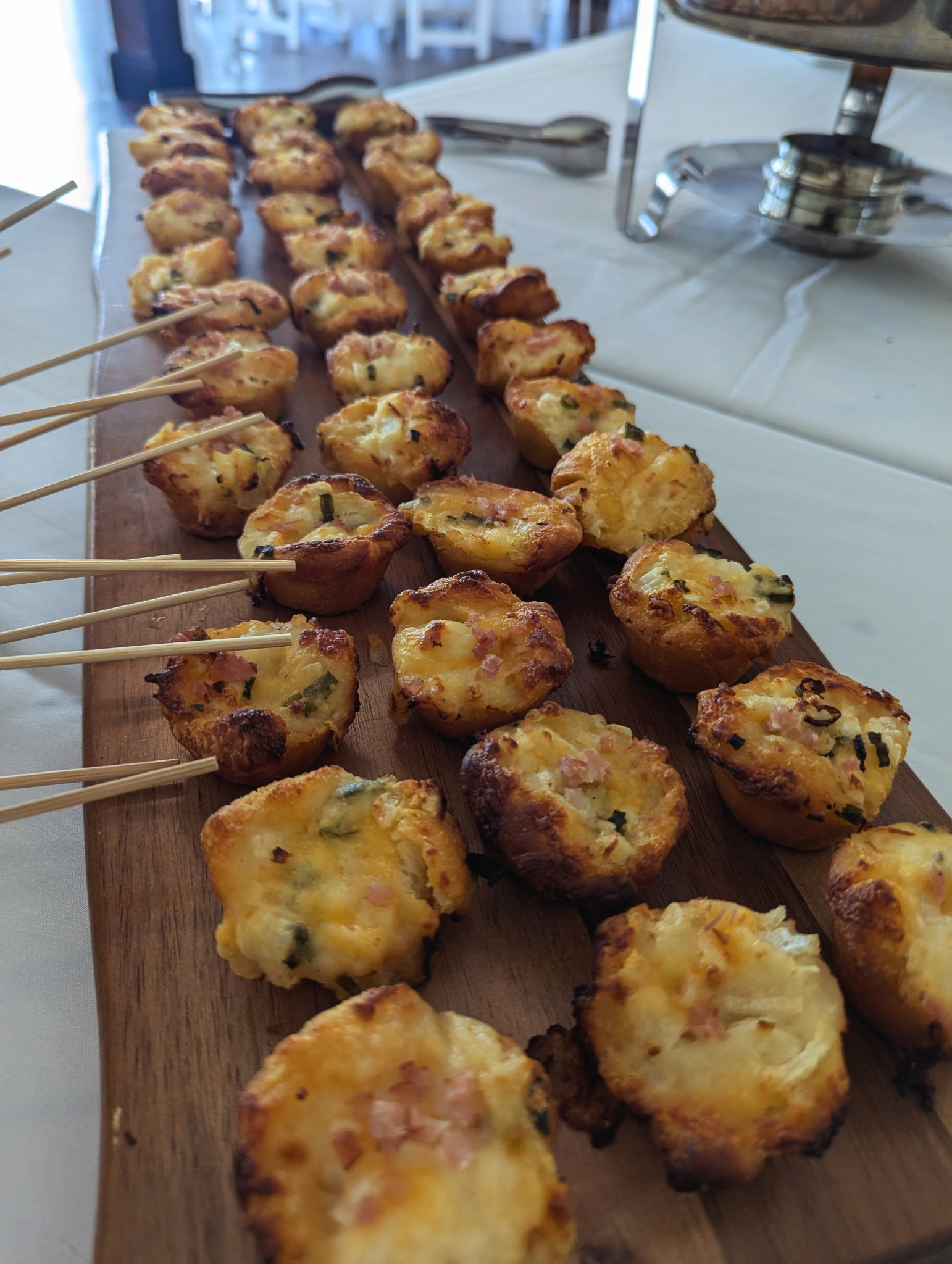 Savory tarts on rustic wooden board